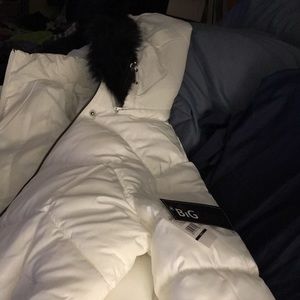 Never worn with tags.beautiful white with black faux fur puffer coat
